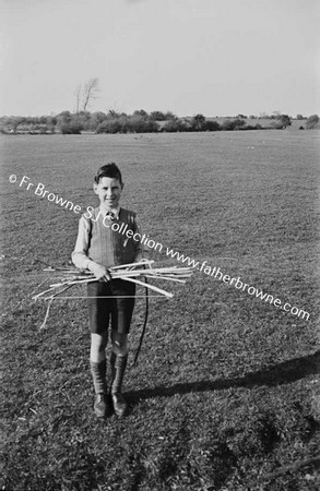BOY WITH TOY BOW AND ARROW